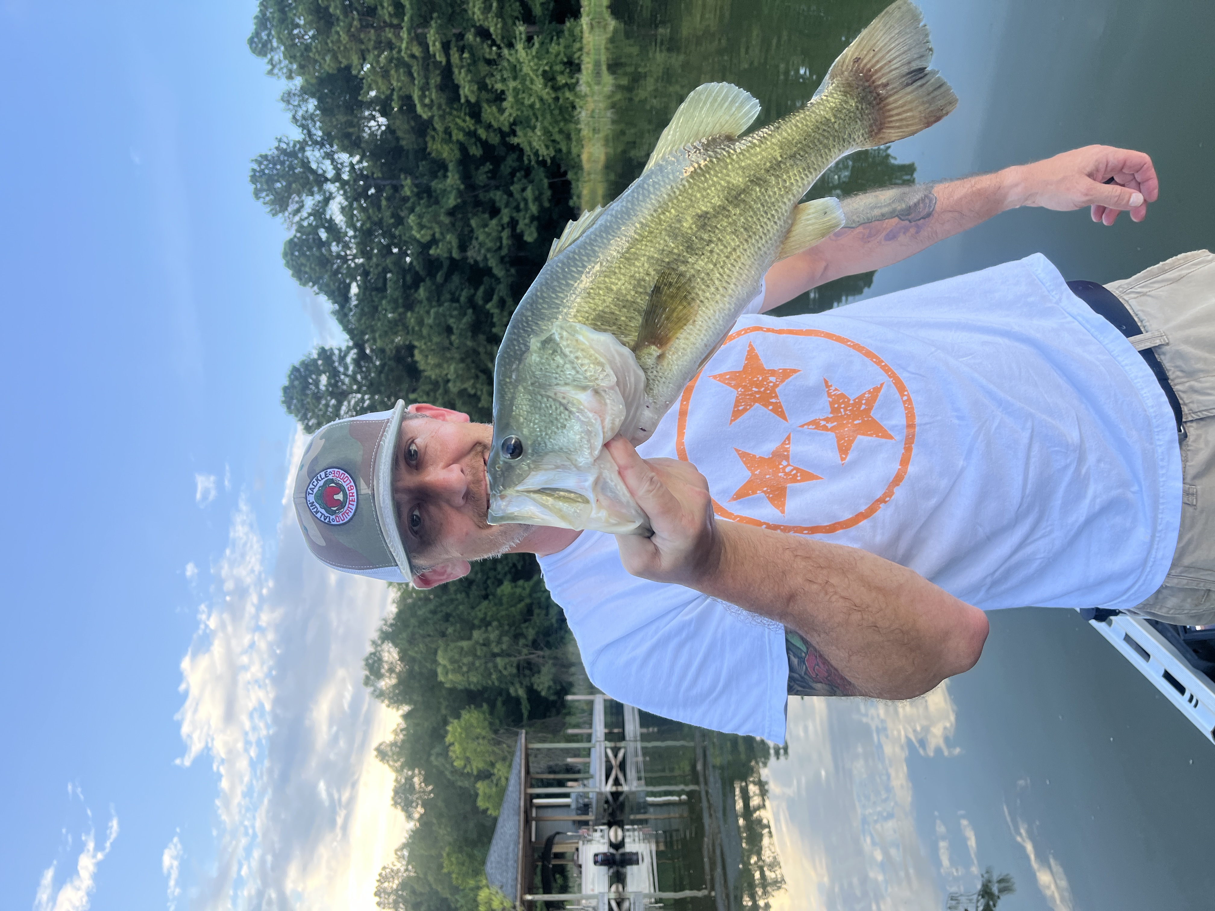Seth Pangle holding a largemouth bass on Chickamauga Lake